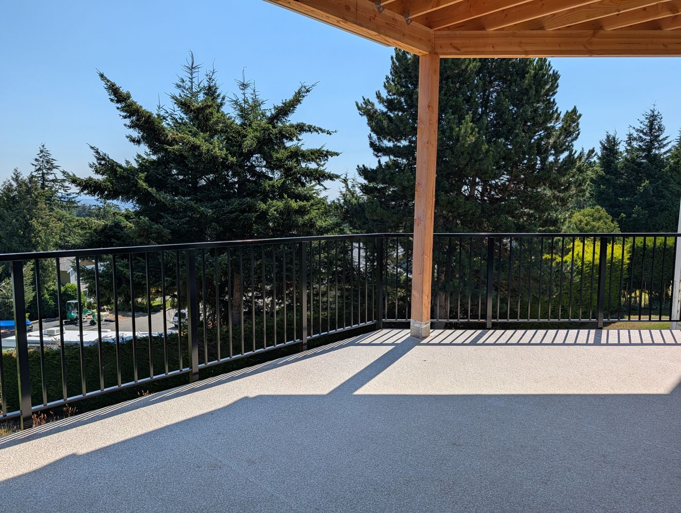 Uncluttered finished covered deck and railings