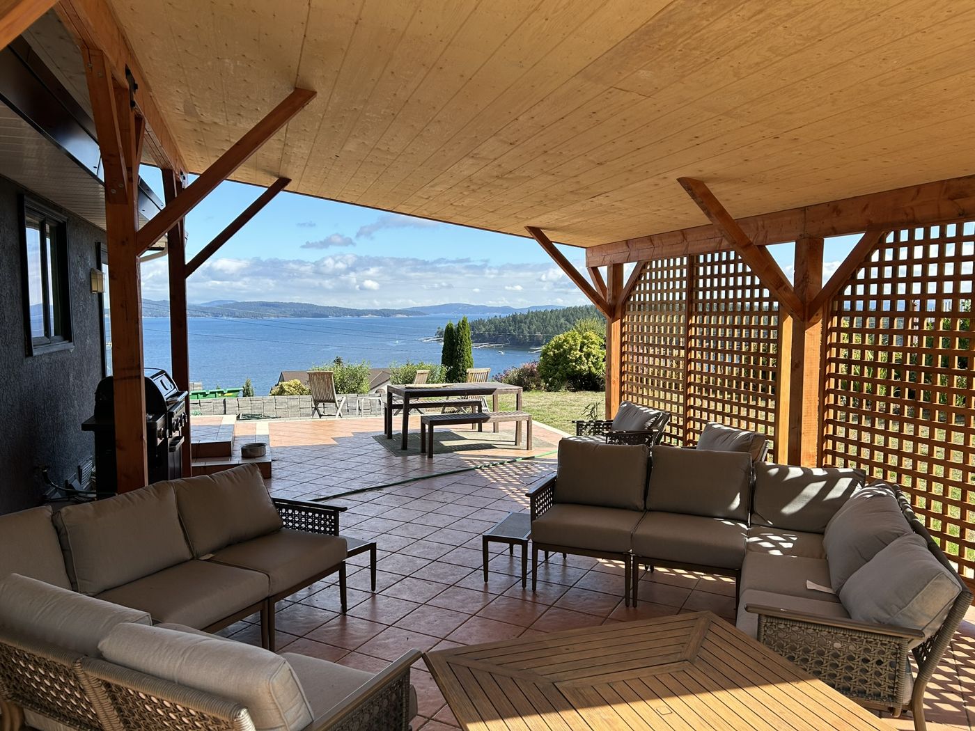 Custom covered outdoor living space by Rise Renovations & Decks